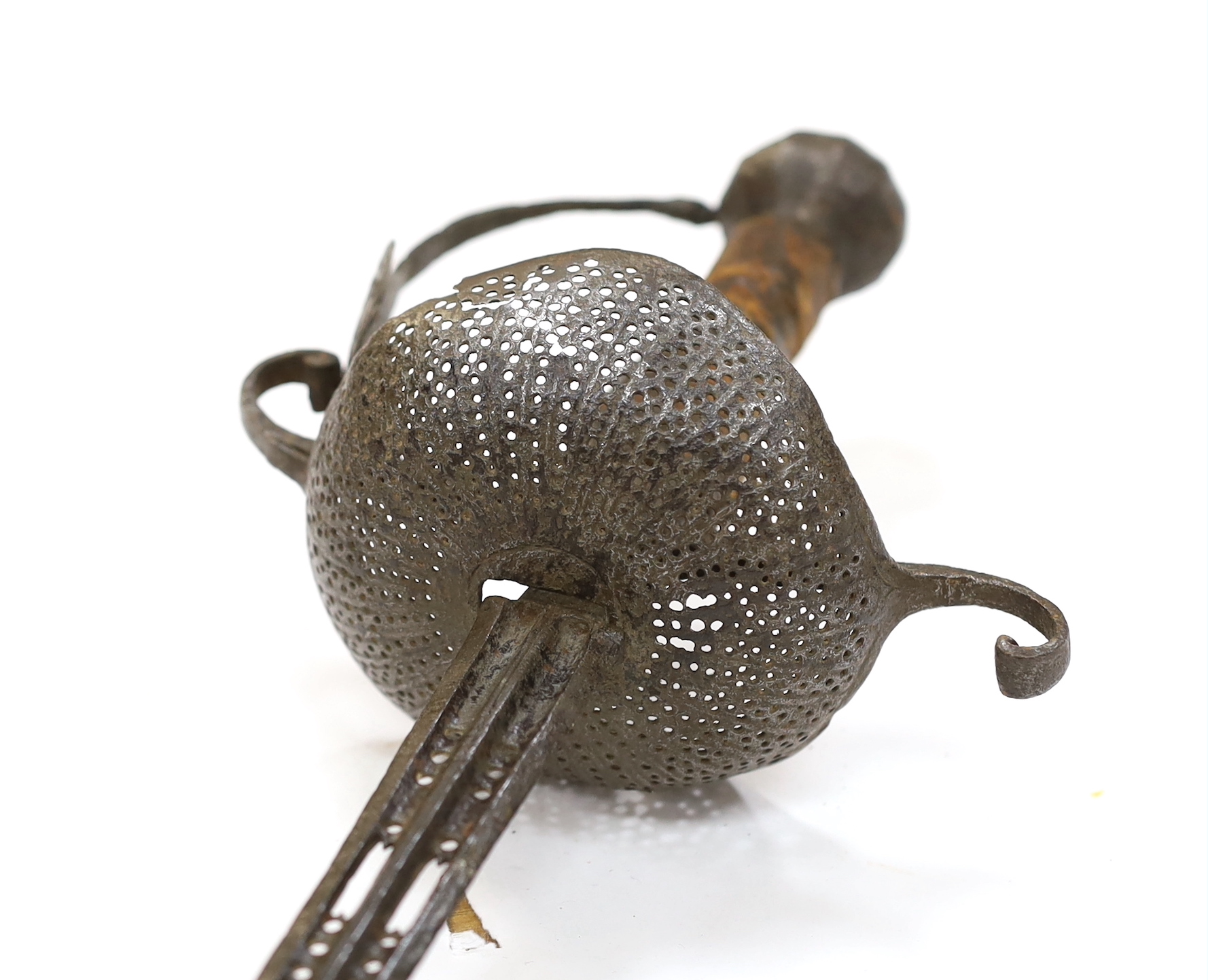 A mid 17th century English rapier, with pierced steel cup guard, loop guard and top of blade, steel pommell and leather grip, blade 77cm